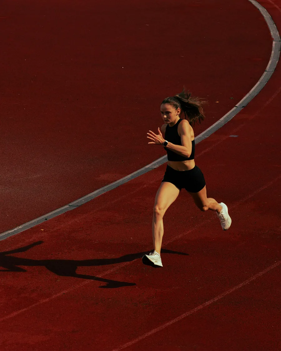 A runner at full stride, wearable on the wrist